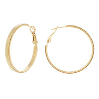 Boucles d'oreilles Calyce créoles dorées texturées Hersée Hersée Paris 9